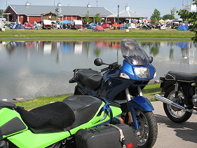 Motorcycles and camping tents at a rally.