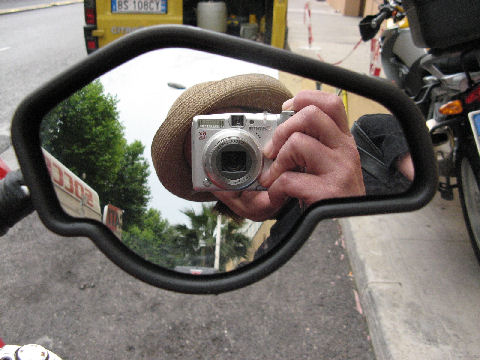 Me, reflected in the mirrored tank of a vintage BMW